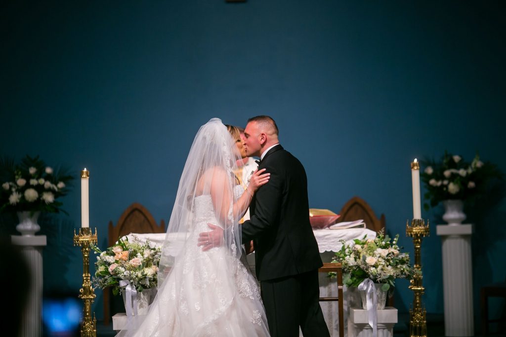 A couple kissed during their wedding ceremony